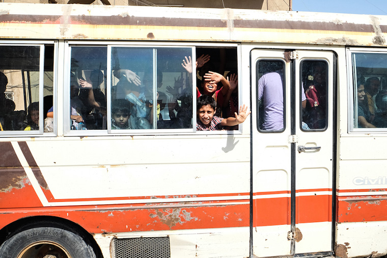 Children piled into a bus, shuttled back home after lesson and a meal at a local community center.