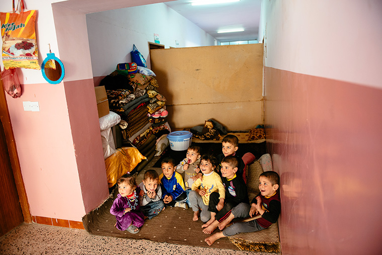 These Iraqi children, displaced by ISIS, have found temporary shelter in a school.