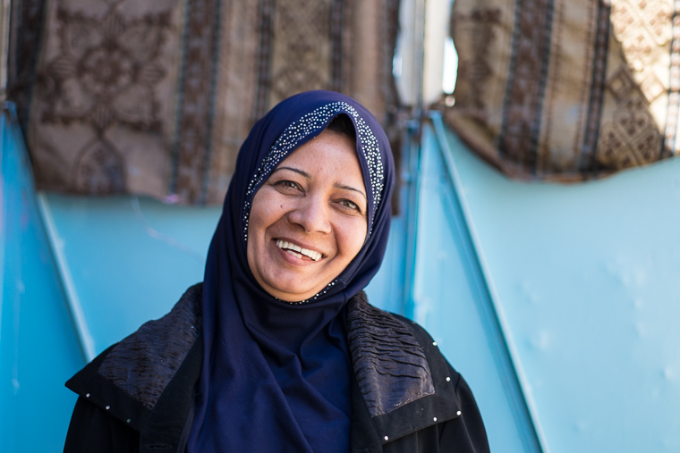 Abeer, a new business woman in Kirkuk, smiles with pride.