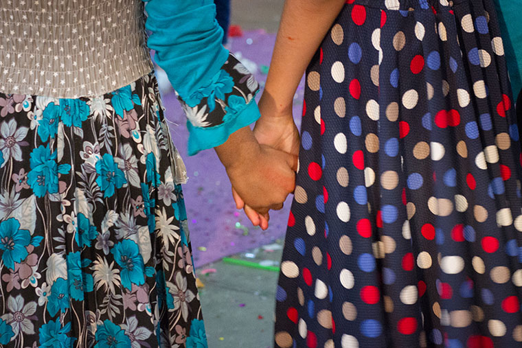 Girls at an Easter party, hosted by a local Assyrian church, hold hands.