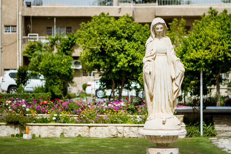 A statue of the Virgin Mary, in a garden in Baghdad.