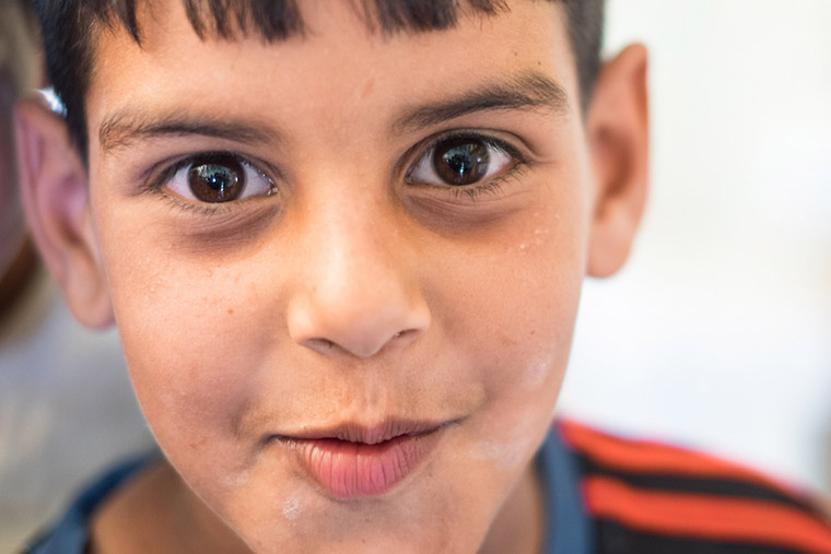 A young boy, displaced from the Anbar Province of Iraq by ISIS, seen by a doctor because of a skin issue.