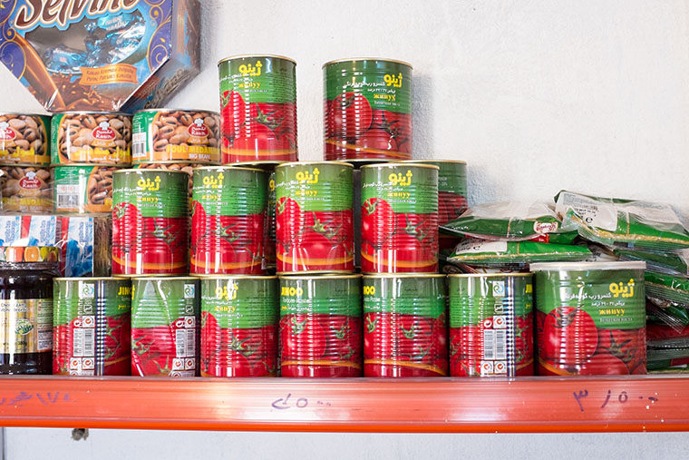 Products neatly line the shelves in Abeer's shop.