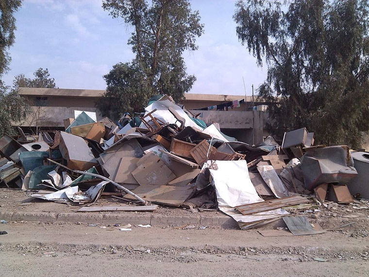 The heap of garbage removed from an abandoned school in Bagdad.